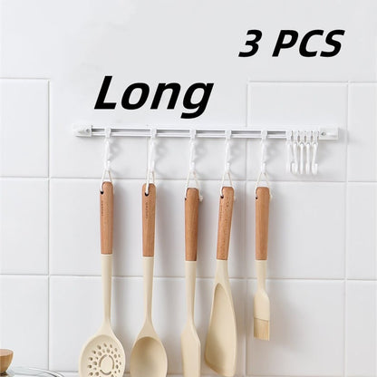 🥳2026 HOT SALE🥳💞50K+ SOLD!🧺🔧 50% OFF! Multifunctional Slide Rail Hook – Punch‑free installation, adjustable hook spacing. Holds utensils, towels & robes – no wall damage! 🏠✨